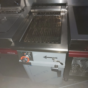 Lotus CW-74G Gas Lava Stone Grill on Open Cabinet